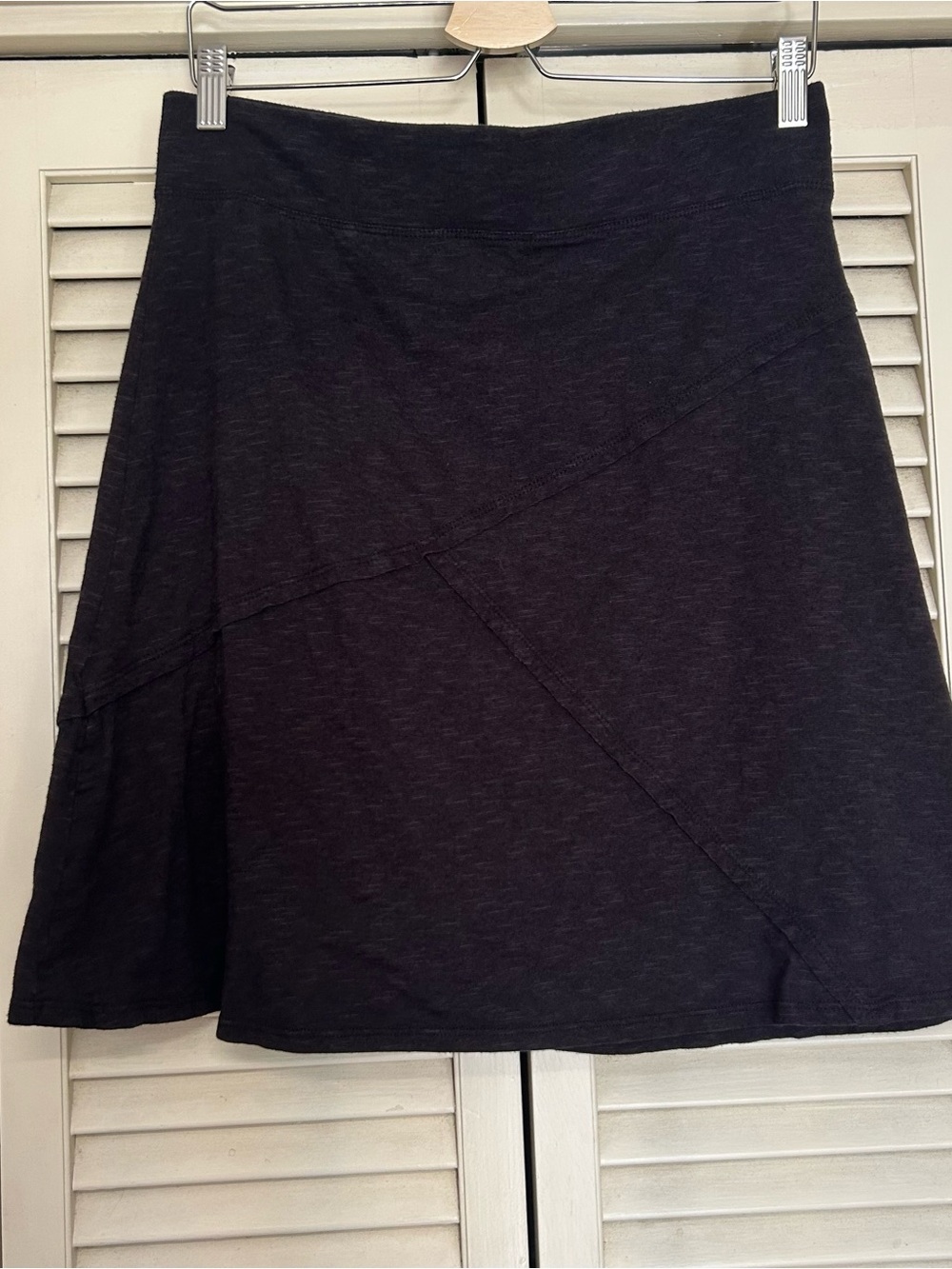 Black heathered mini skirt with diagonal seam detail